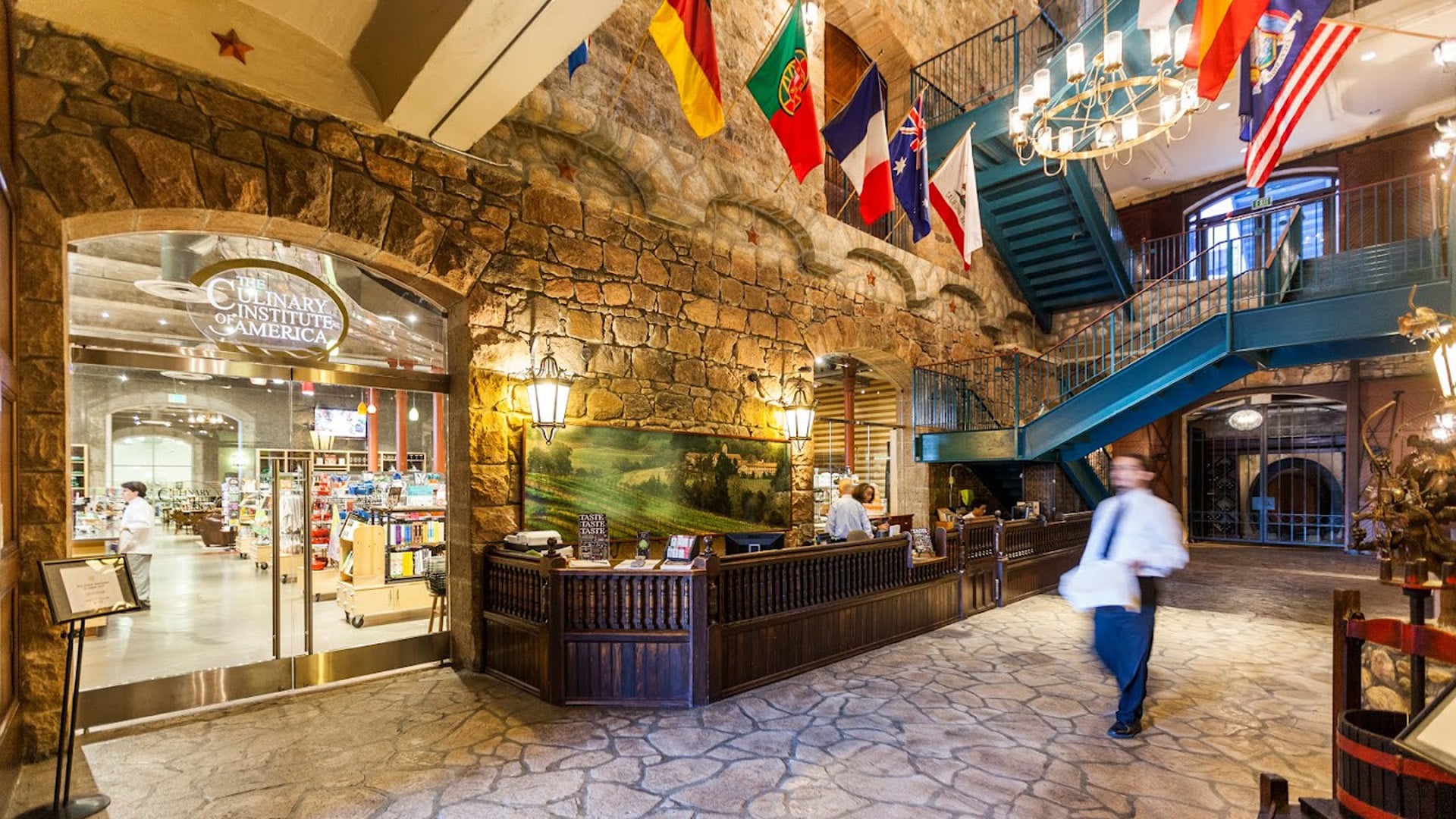 Culinary Institute entrance with flags and staircase.