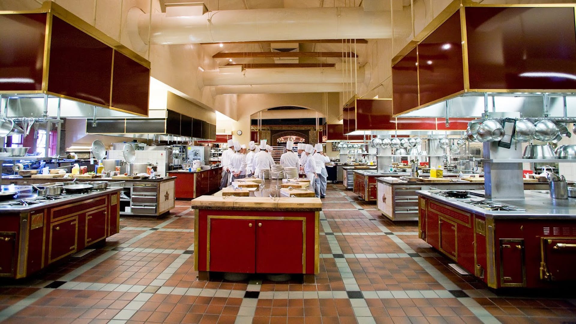 Chefs working in a large professional kitchen