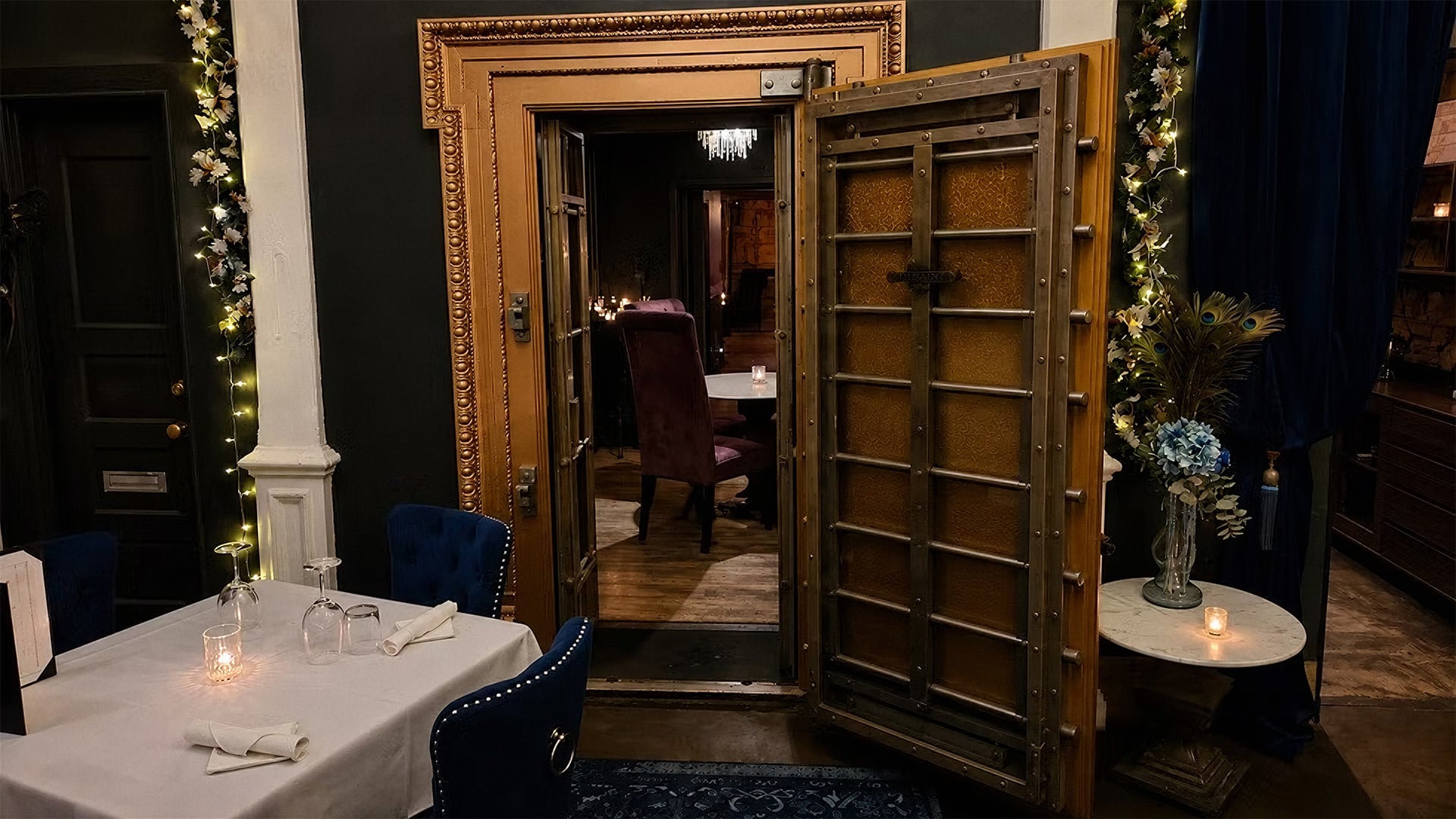 Open vault door in an elegant candlelit restaurant