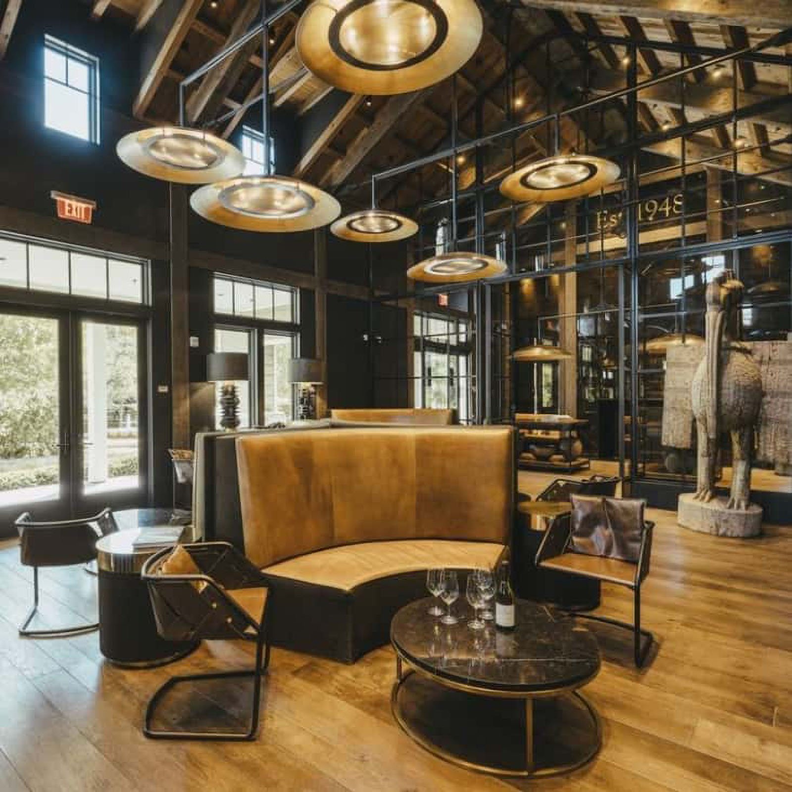 Modern lounge with leather seating and large windows.