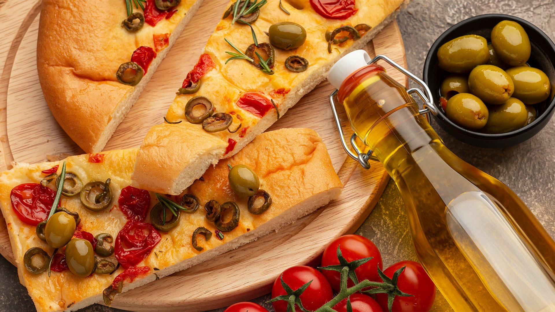 Olive and tomato focaccia with olive oil