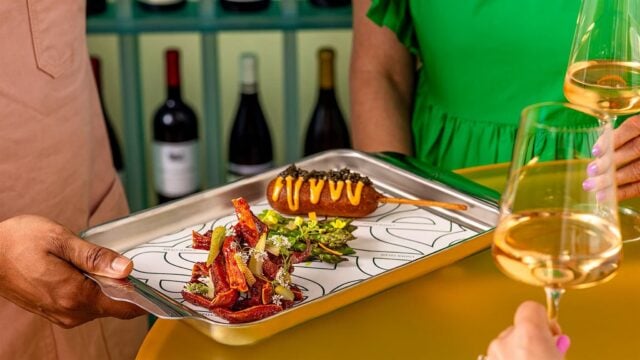 Appetizer tray with wine glasses and dishes