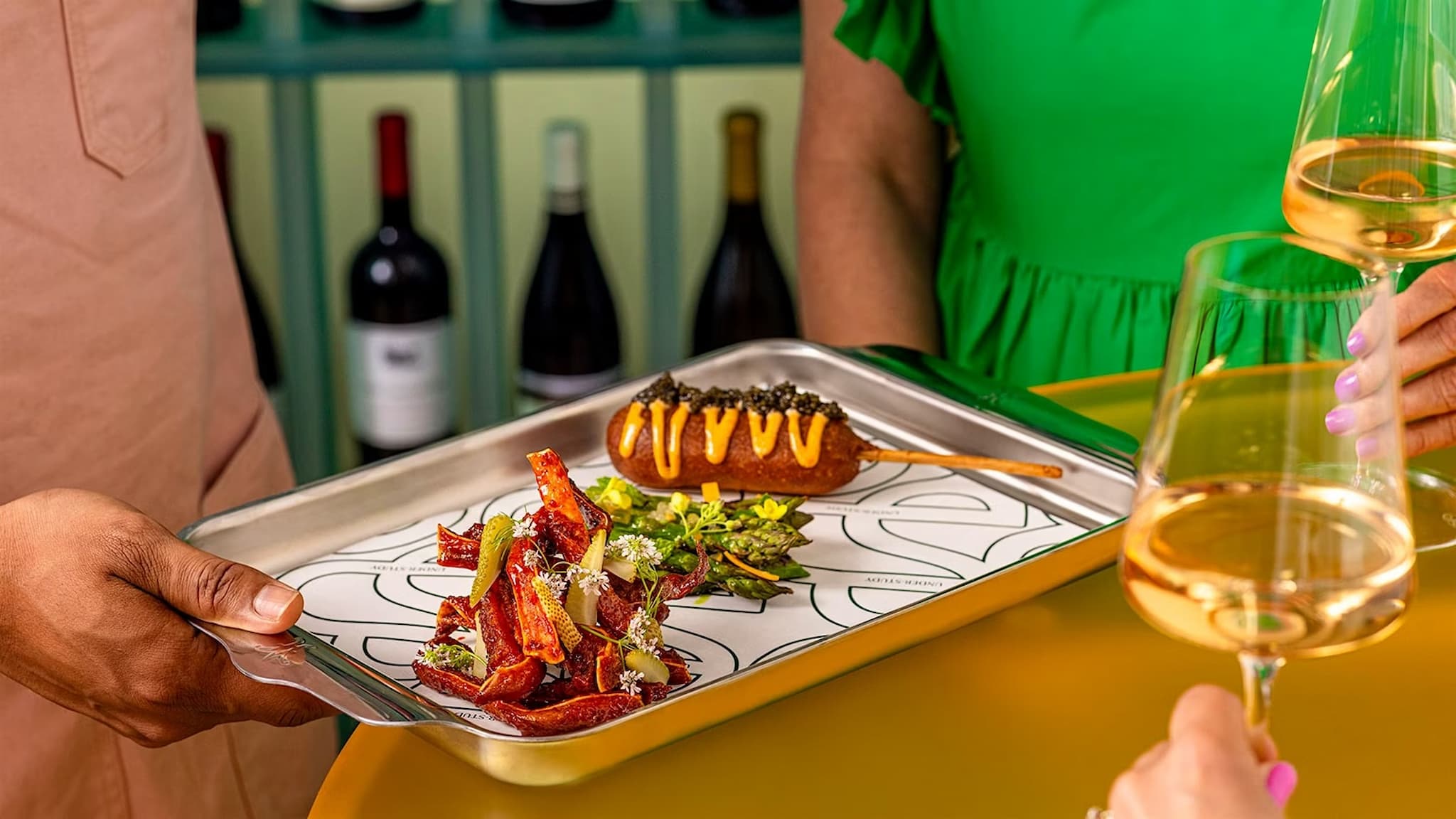 Appetizer tray with wine glasses and dishes