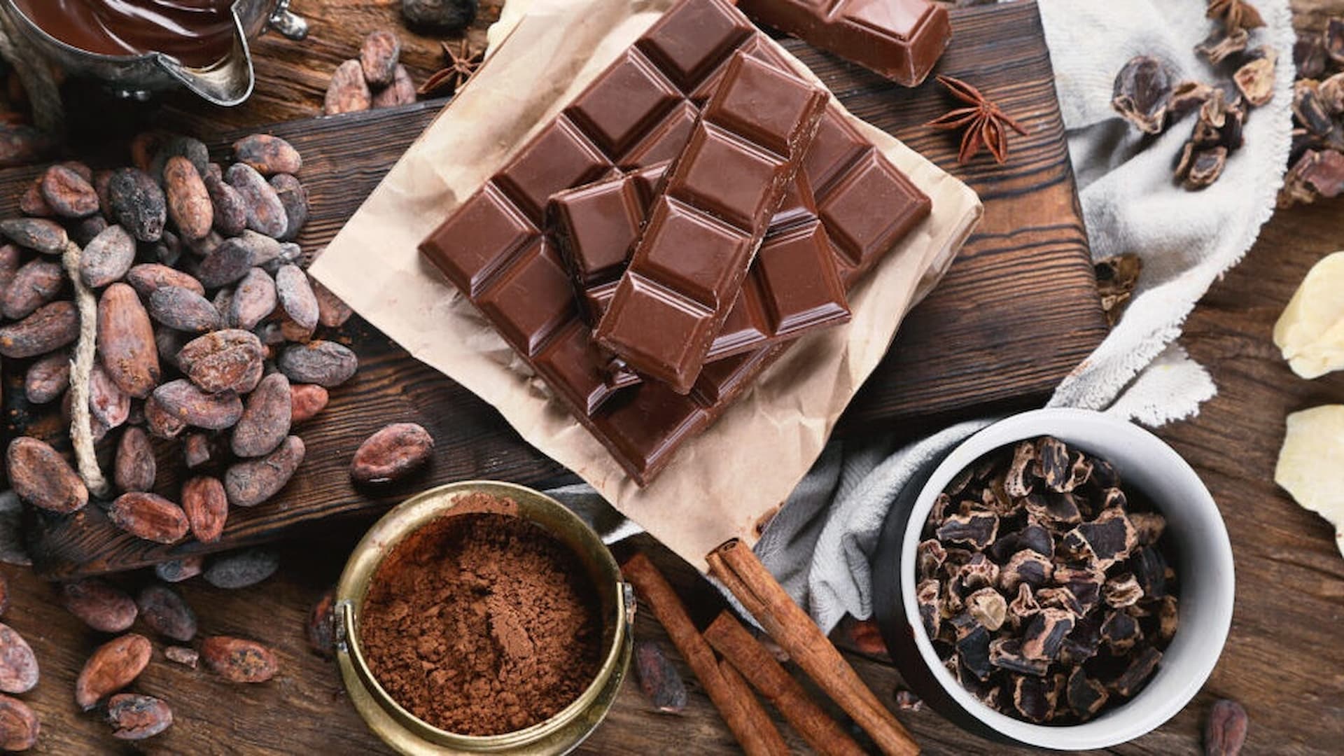 Chocolate bars with cocoa beans and powder.
