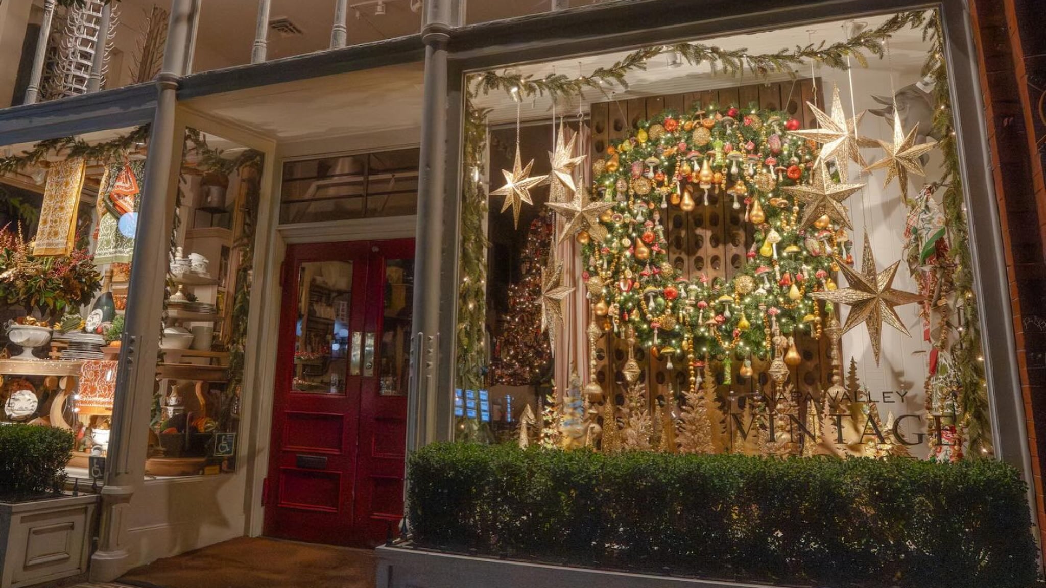 Festive Christmas window display with wreath and stars
