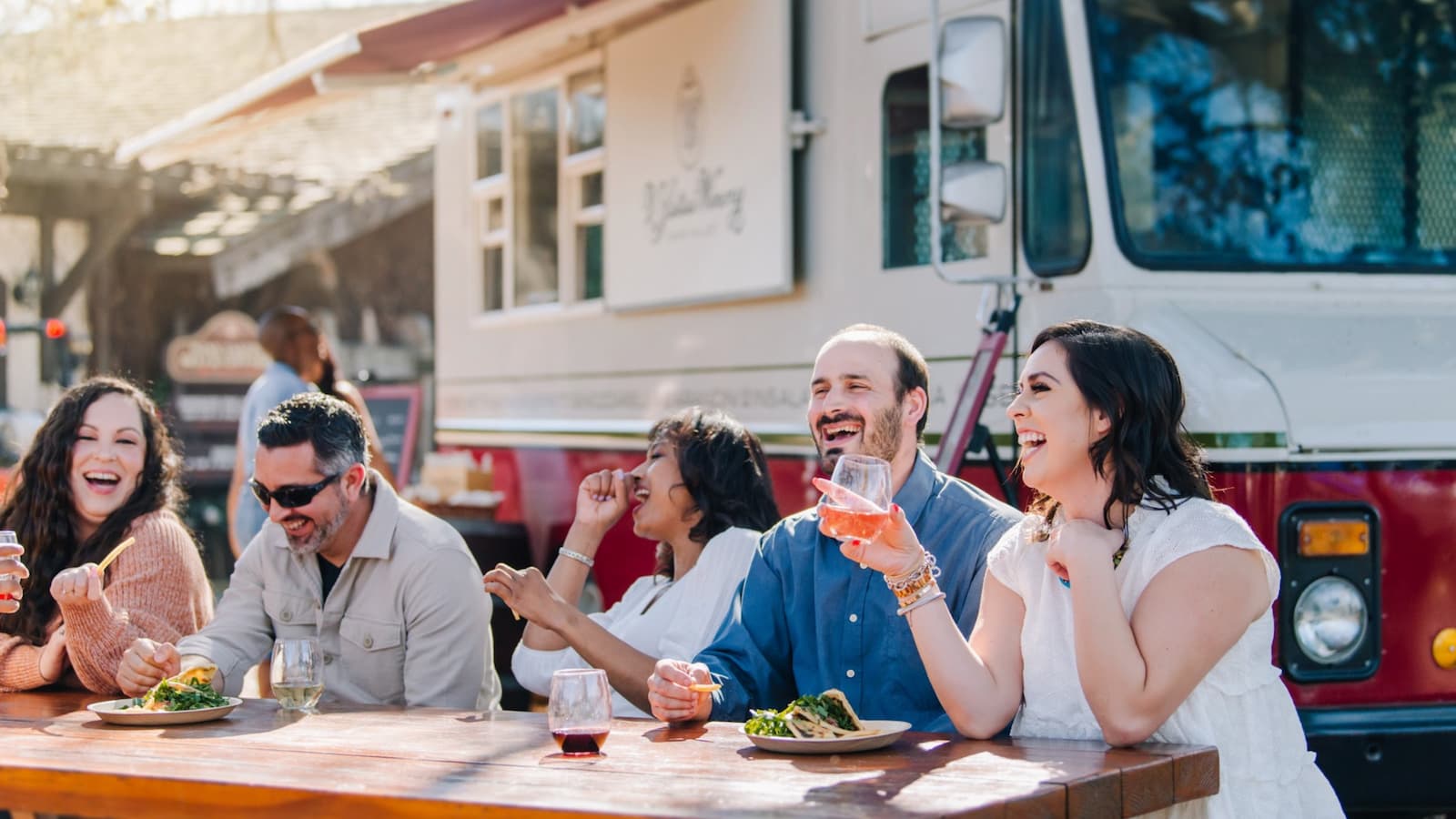 Group enjoying food and drinks outdoors