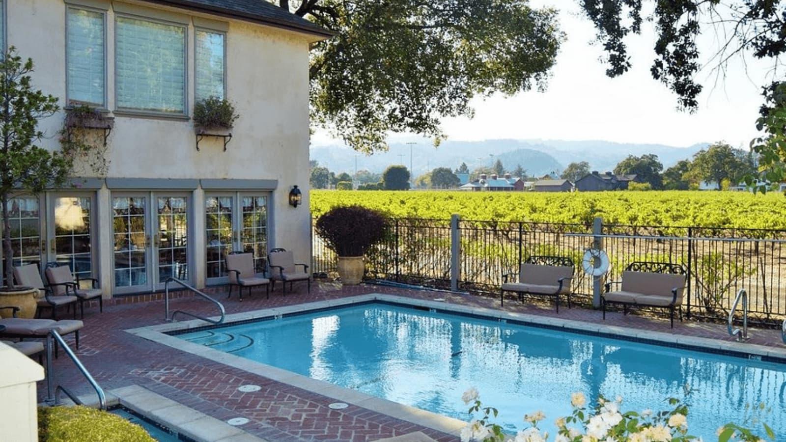 House with pool and vineyard view.