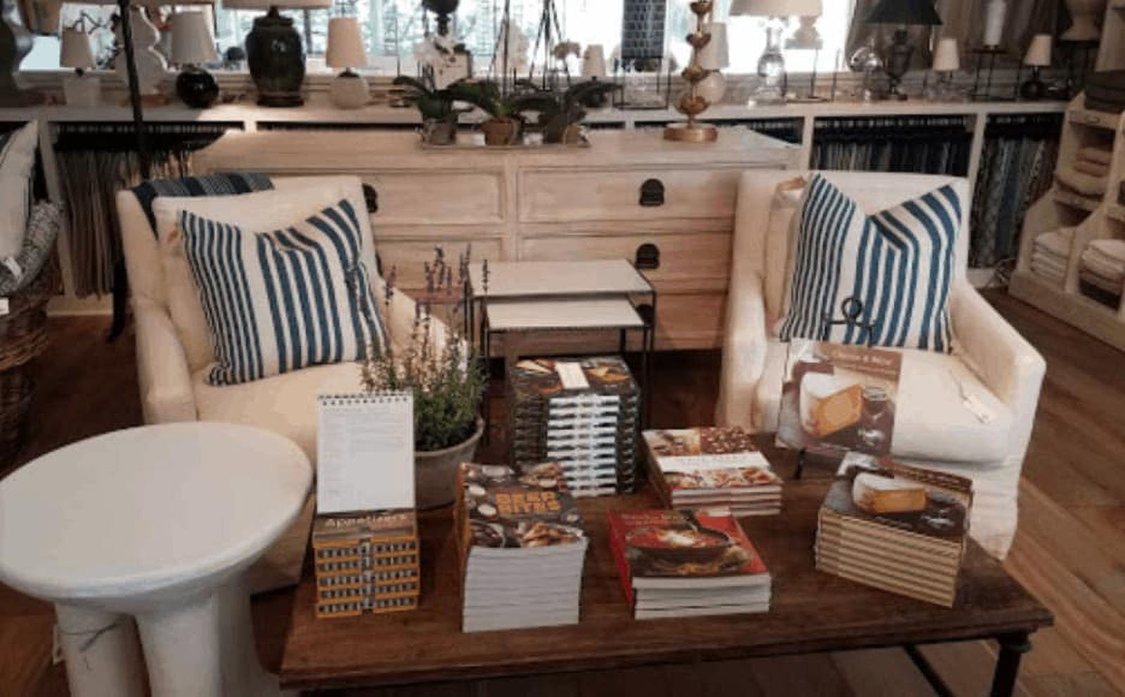 Cozy seating area with books and pillows.