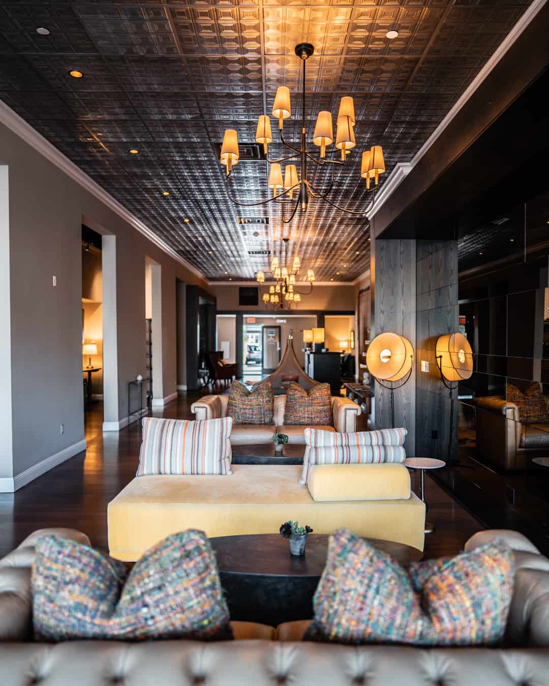 Elegant hotel lobby with modern decor and seating.
