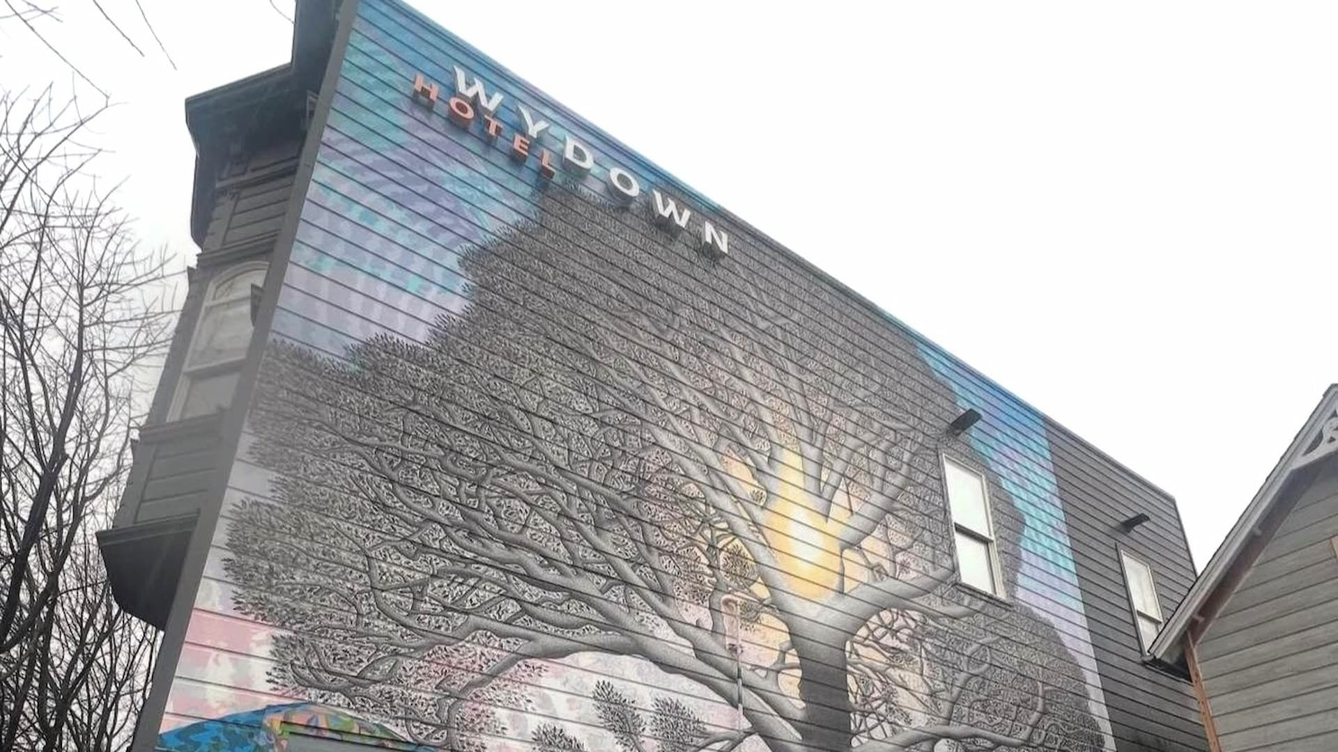 Hotel mural with colorful tree design