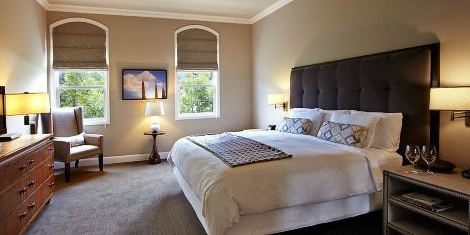 Cozy bedroom with double bed and two windows